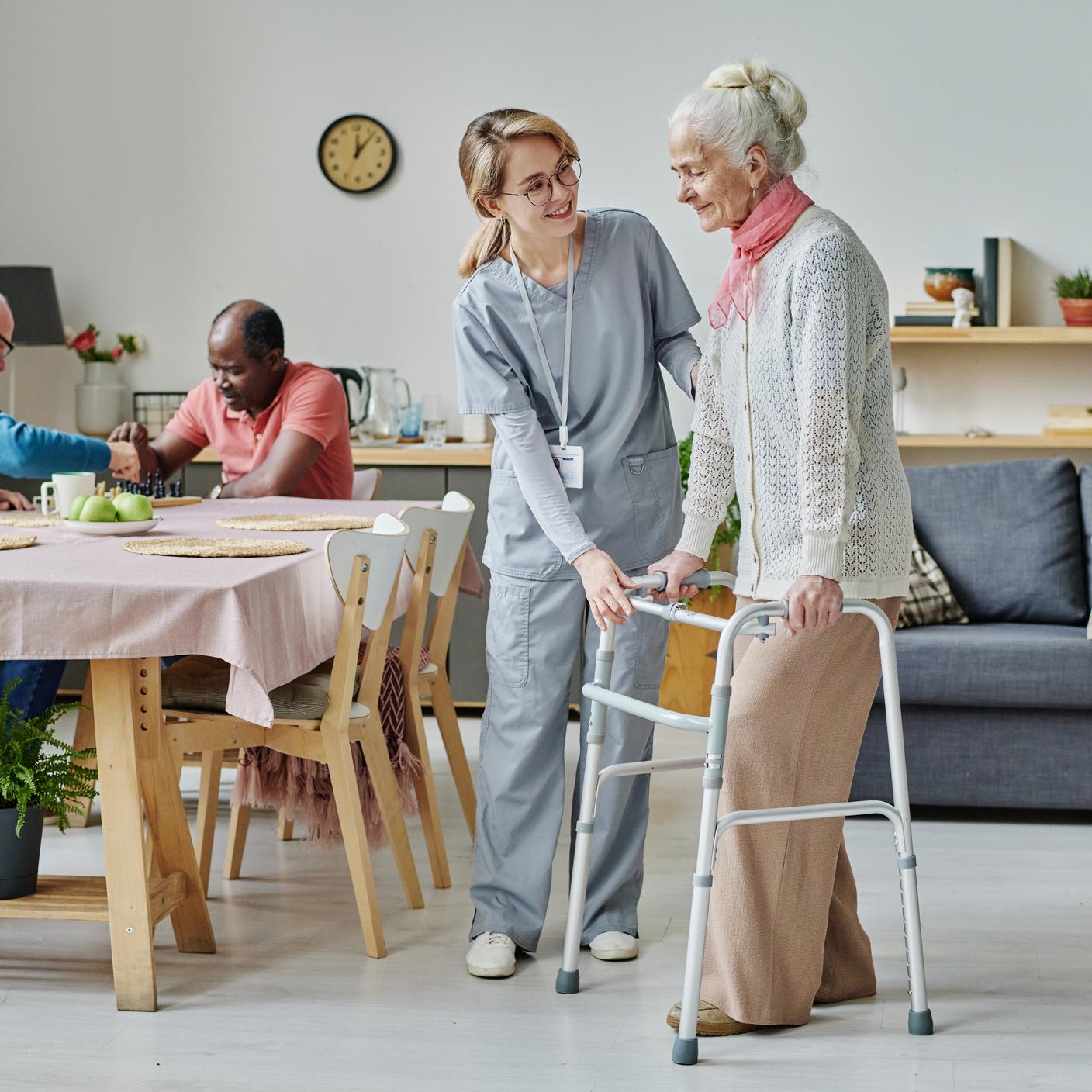 Nurse helping elderly patient 