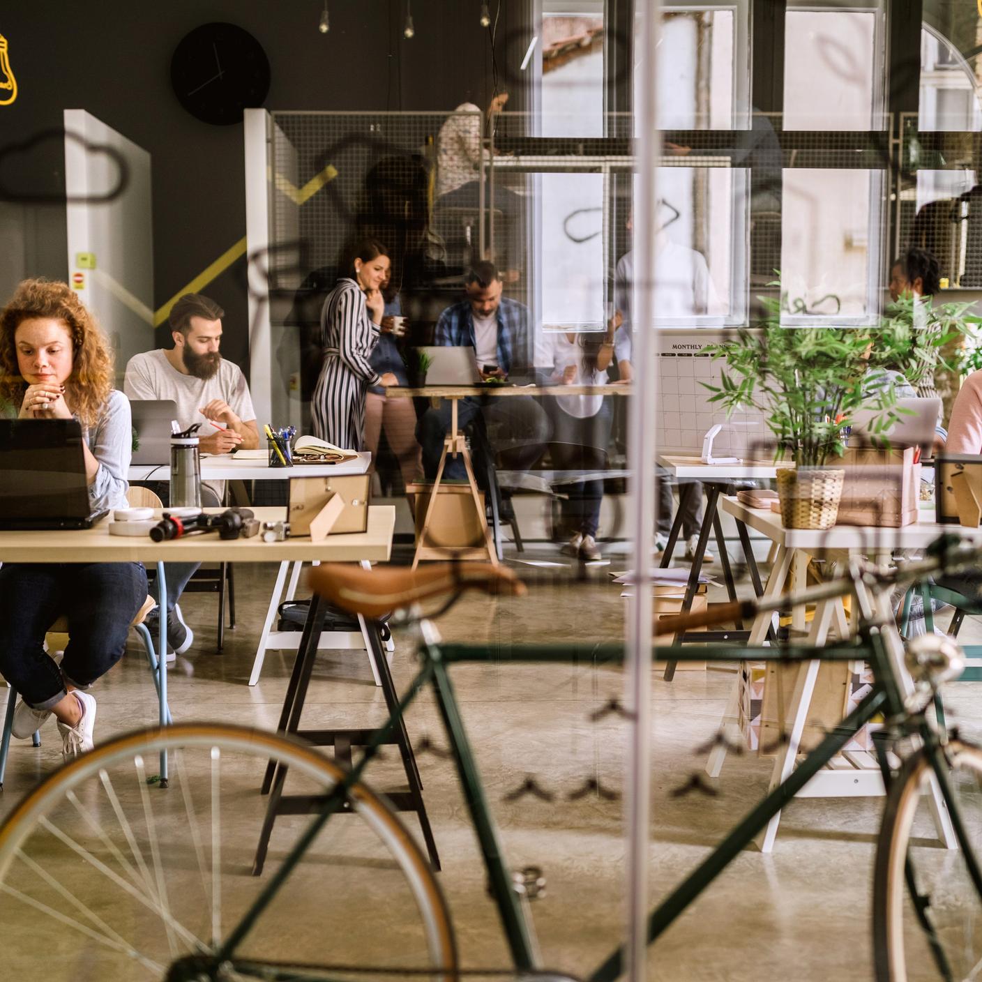 SGK Put Sustainability at the Heart of Transformation - Bicycle in co-working space