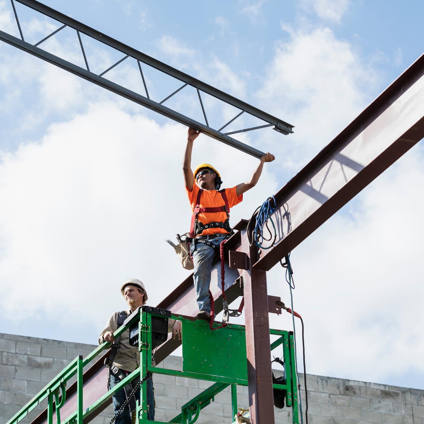 Construction workers on a scissor lift