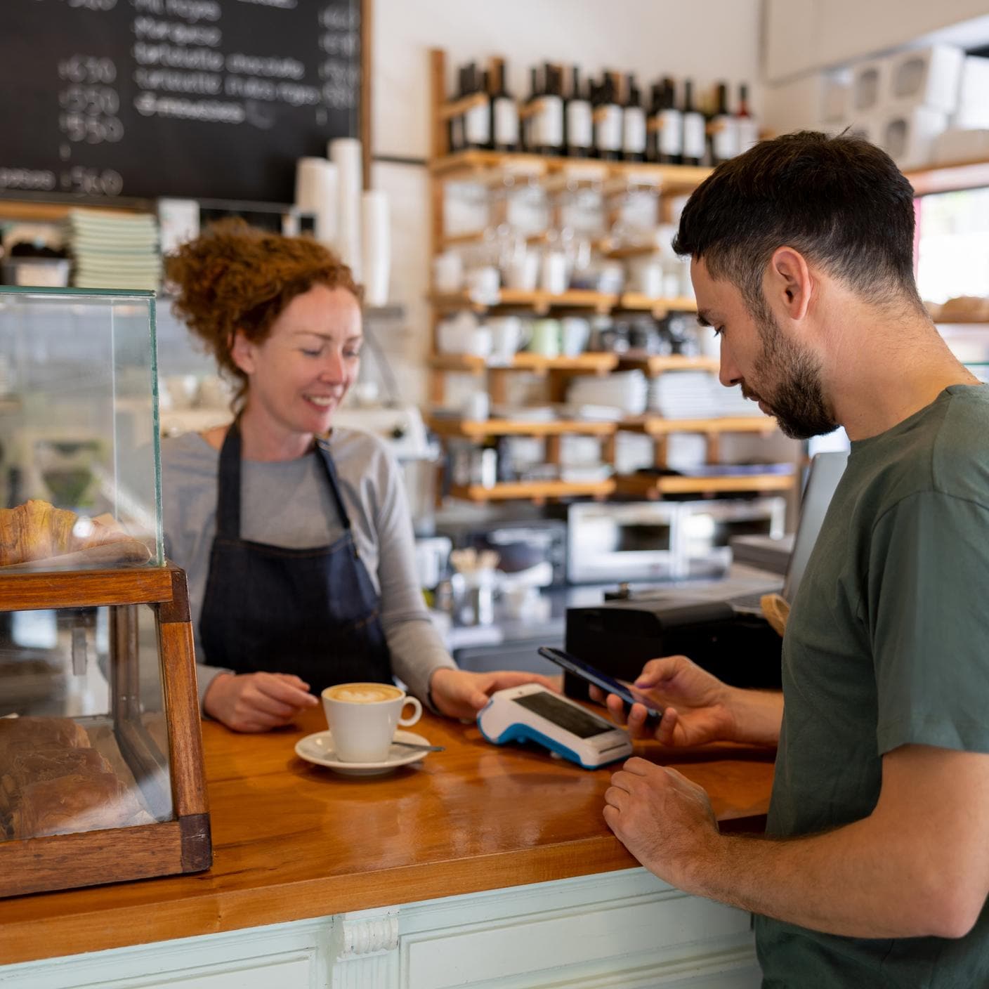 Lady taking payment for her small business