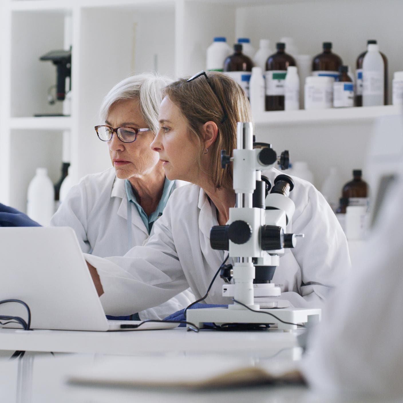 Science, medicine and research, women in laboratory with laptop and equipment