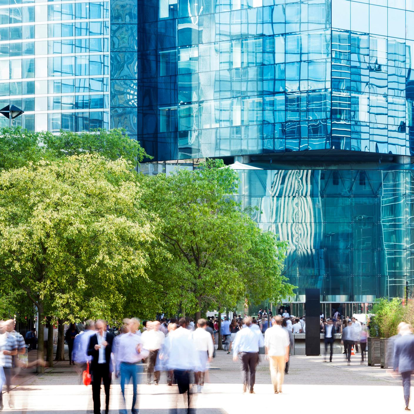 Group of Business People Walking Toward Office Building Entrance, La Defense, Paris, France.