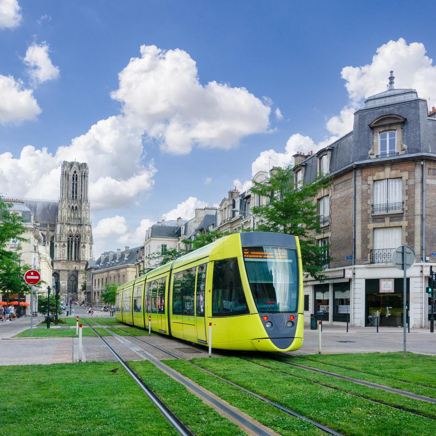 A tram running through the streets of city in France