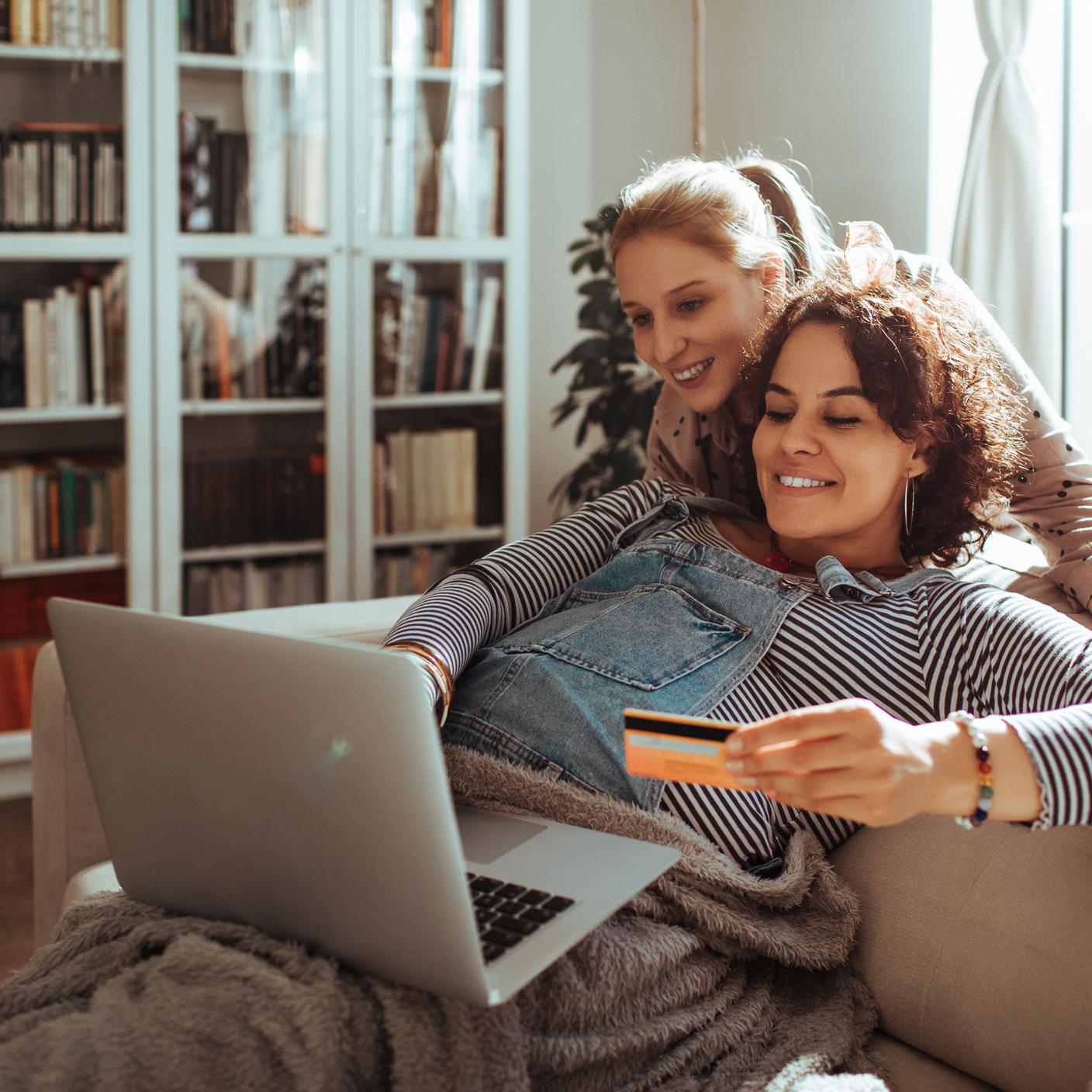 couple online shopping on their laptop