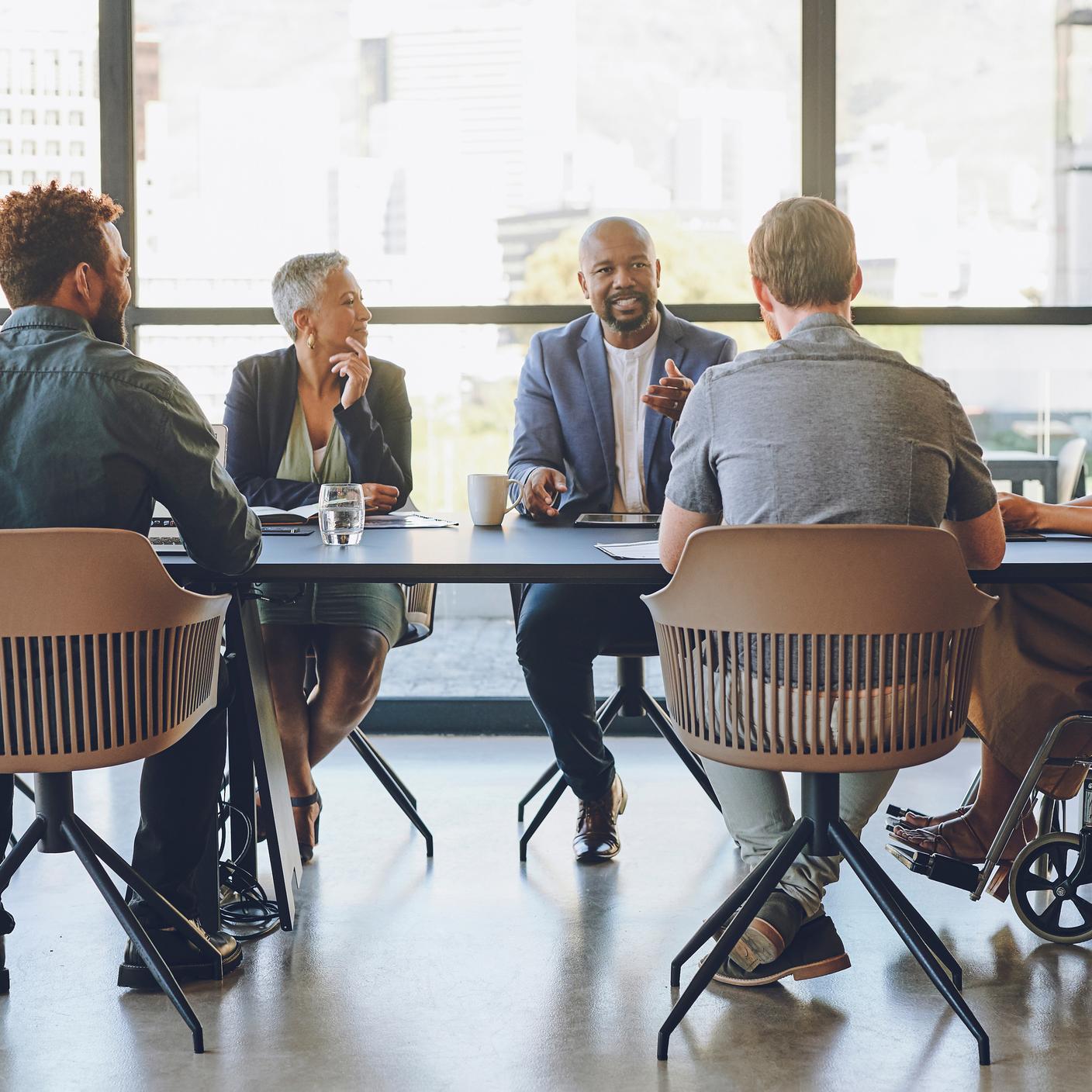 Disability, diversity and business meeting with staff