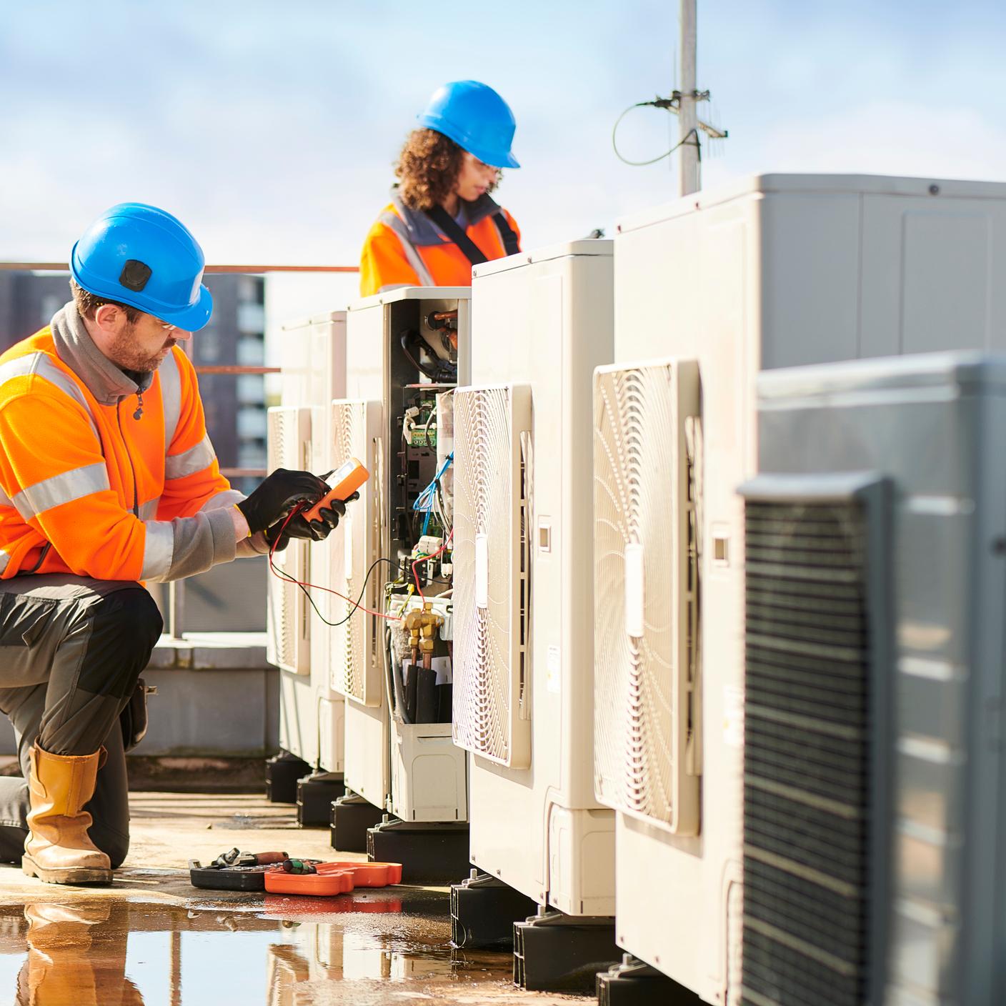 Electrical engineer working on an electrical installation in a rooftop.