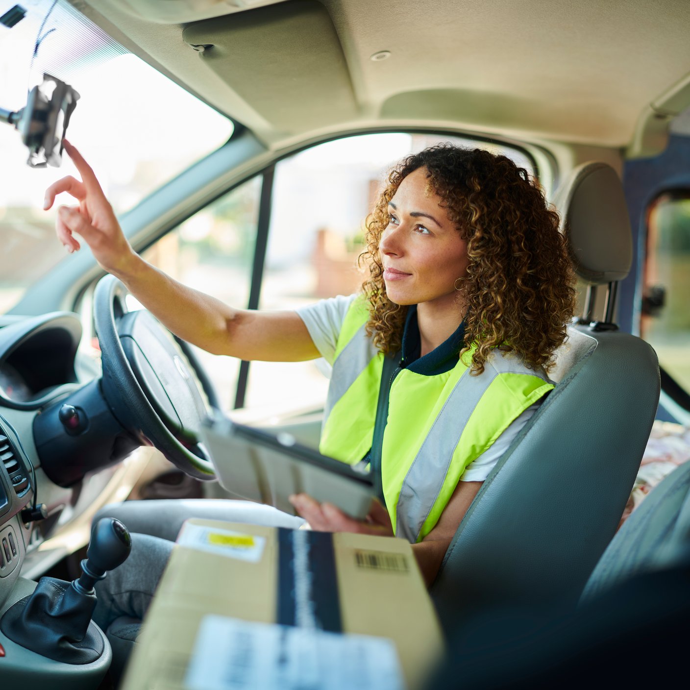 Delivery Driver with Satnav and Package