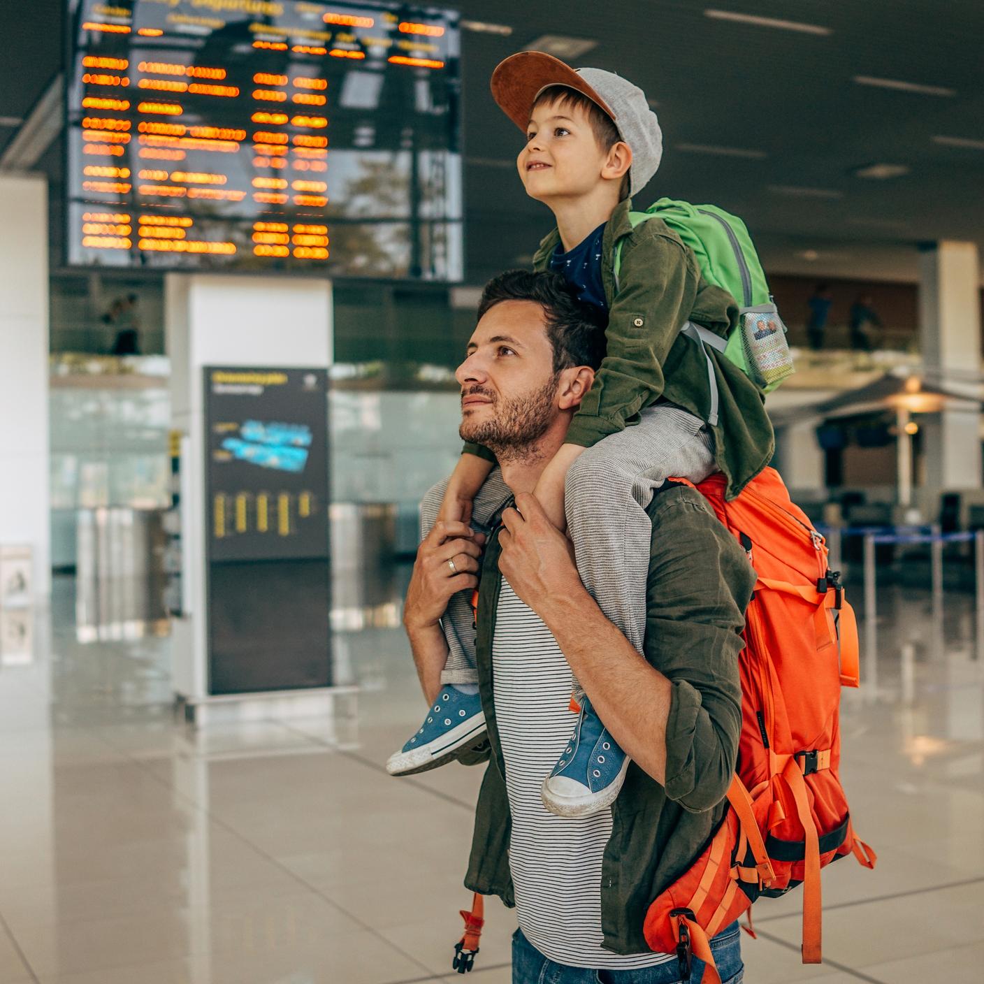 Photo of a cheerful little boy and his father