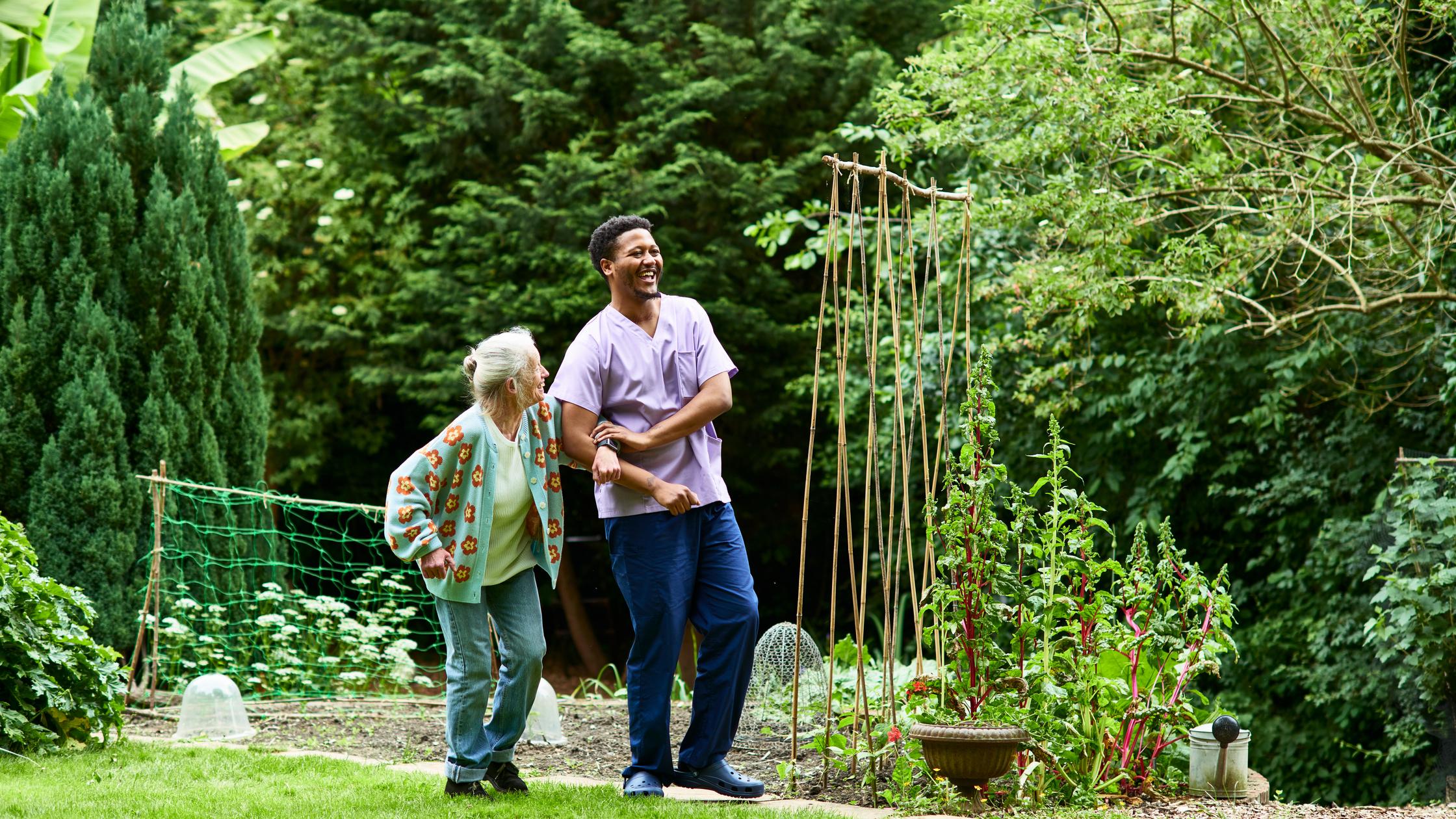 sustainability healthcare senior being helped by carer