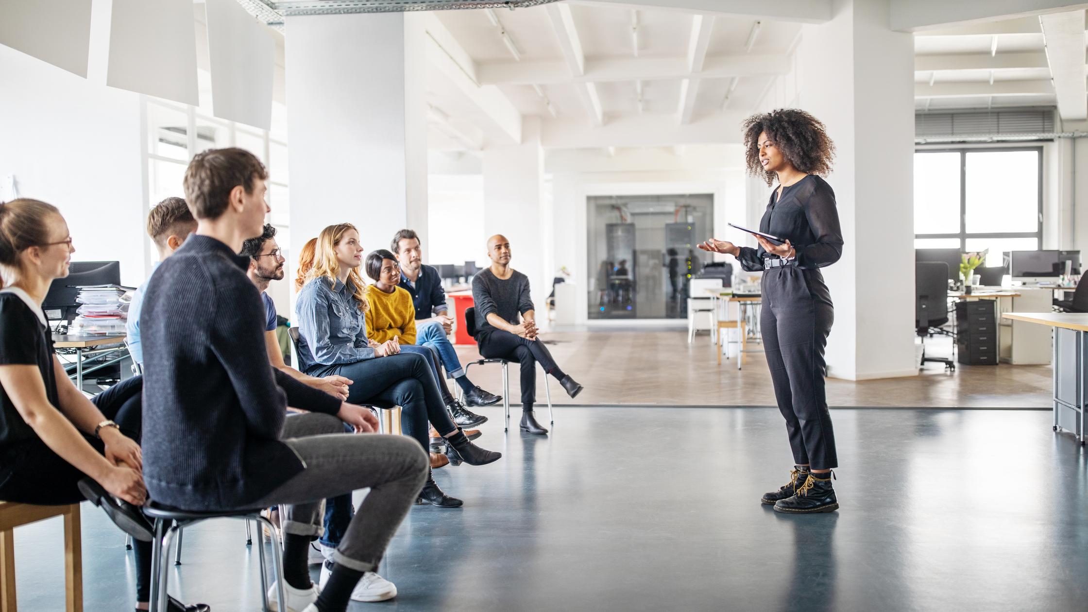 Woman speaking in front of audience