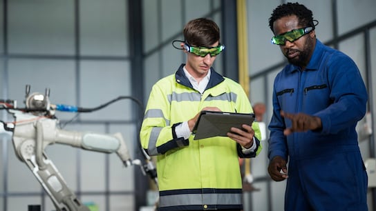 Engineers wearing glasses are simulating of a process improvement with cloud computing technology