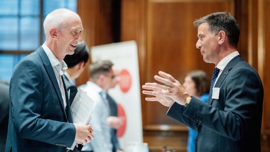 Two men discussing together